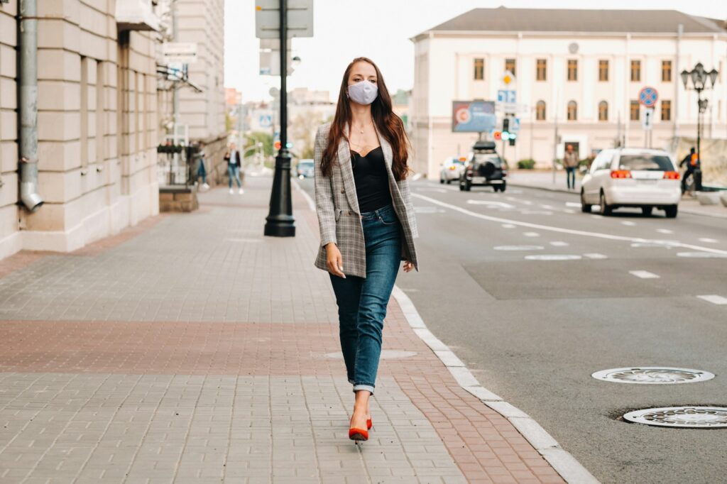 Covid-19 and Air pollution pm2.5 concept. Pandemic, portrait of a young woman wearing protective