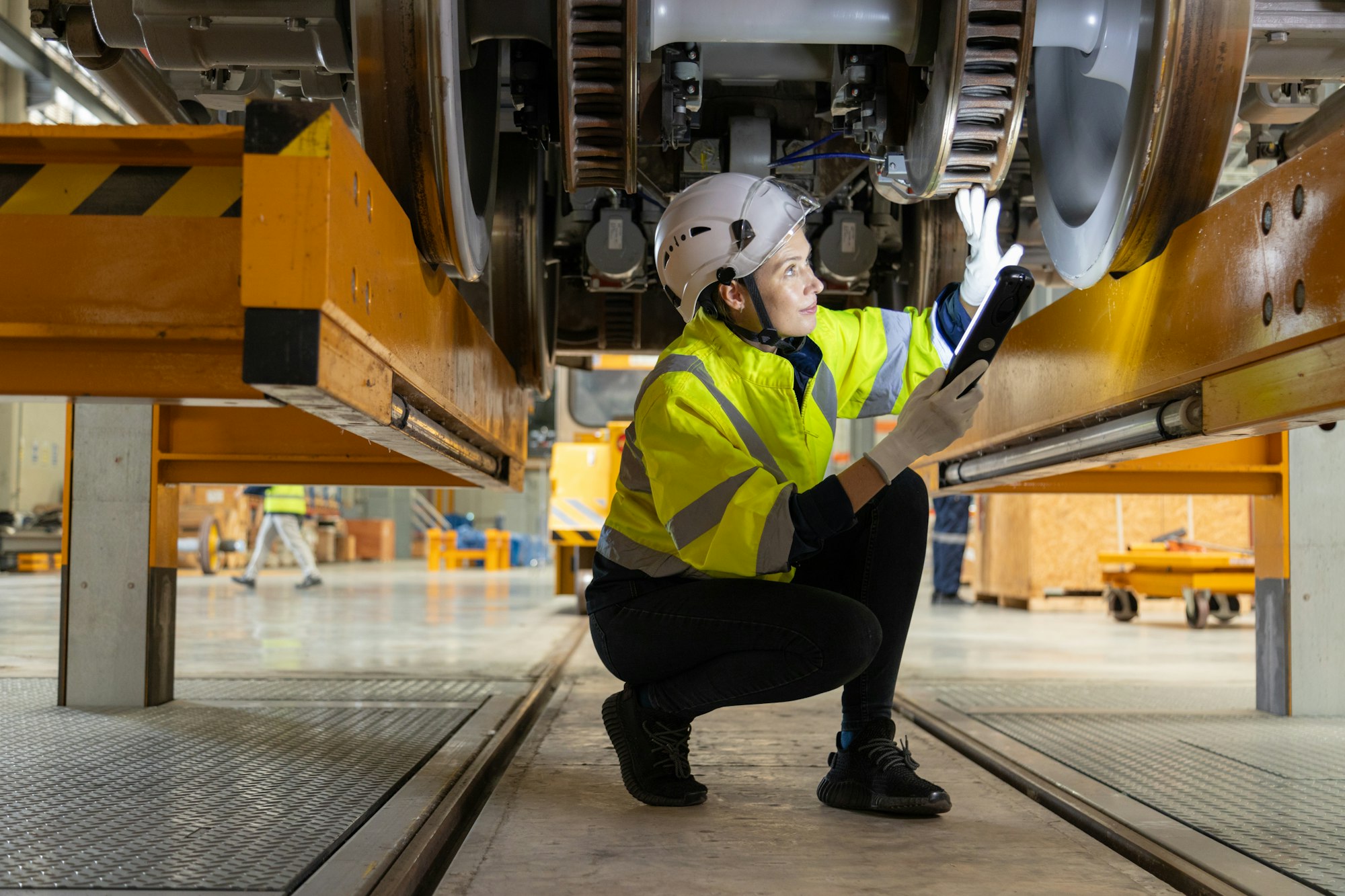 Engineer checks spare parts list and maintains mass transit locomotives in Asia