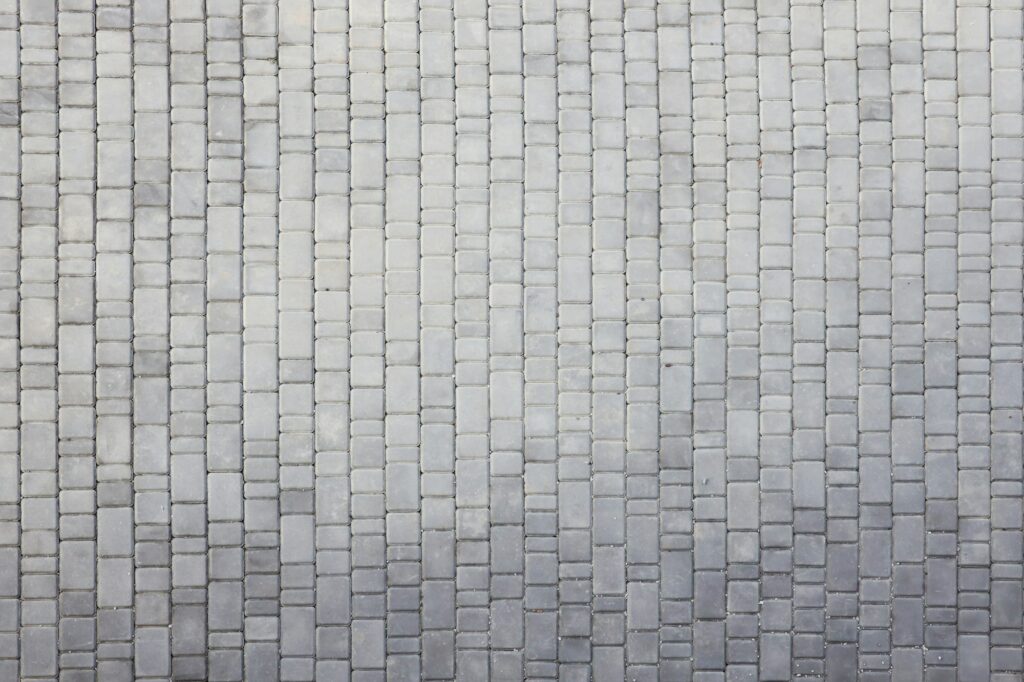 Gray color paving slabs in the pedestrian street sidewalk